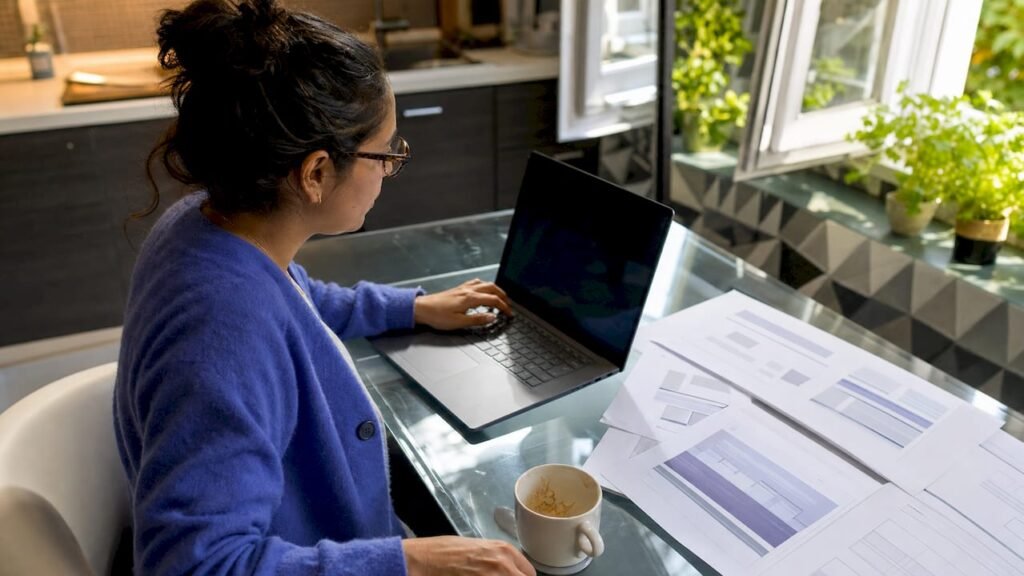 Woman reviewing thank you page on laptop